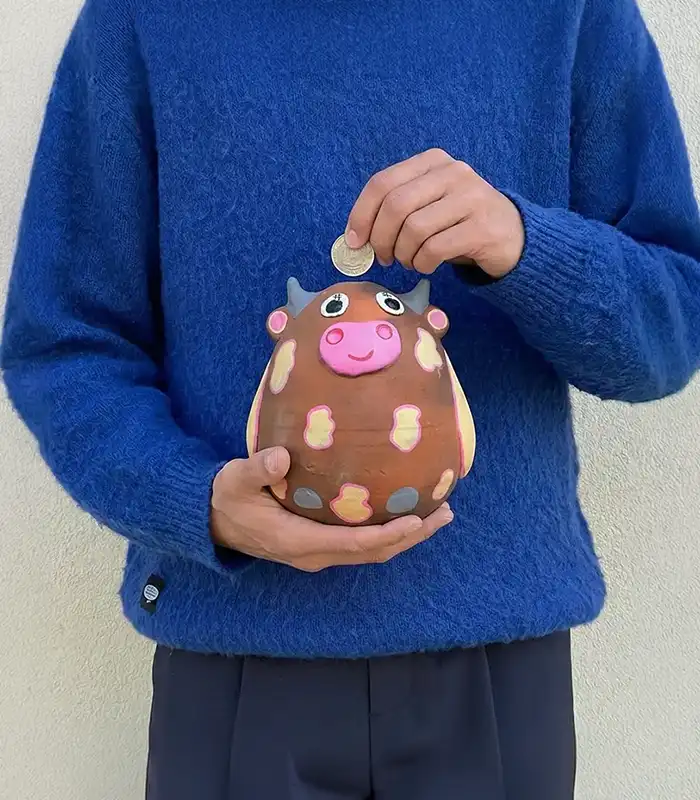 Handmade terracotta cow piggy bank by Pipihiri