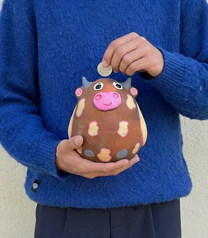 Handmade terracotta cow piggy bank by Pipihiri
